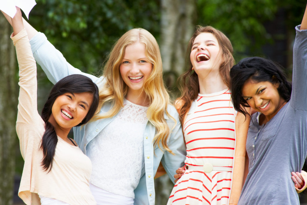 Four Teenage Girls Celebrating Successful Exam Results